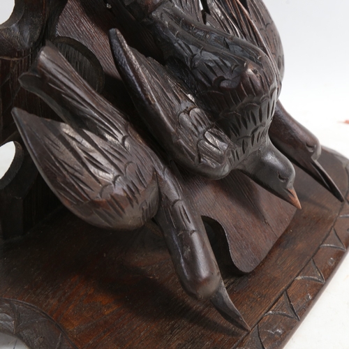 574 - A Black Forest carved wood wall  bracket, supported by 3 birds, height 46cm