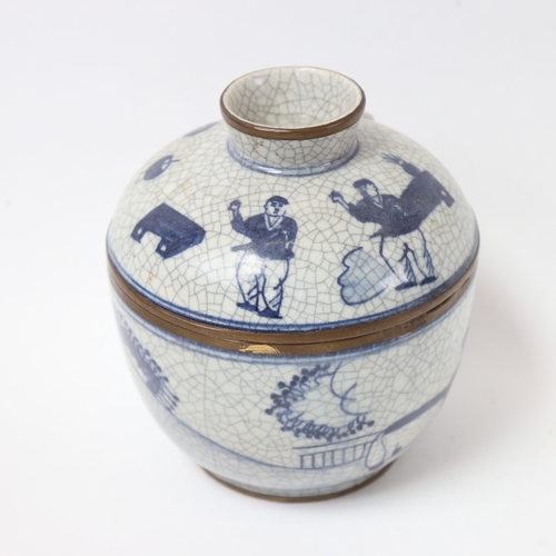 583 - A Chinese blue and white crackle glaze jar and cover, with brass mounts, height 15cm