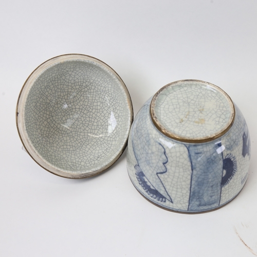 583 - A Chinese blue and white crackle glaze jar and cover, with brass mounts, height 15cm