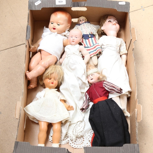 438 - A group of porcelain and composition dolls