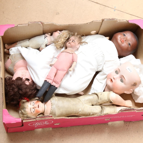 439 - A group of porcelain and composition dolls