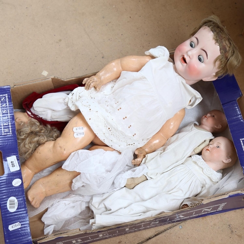 440 - A group of porcelain and composition dolls