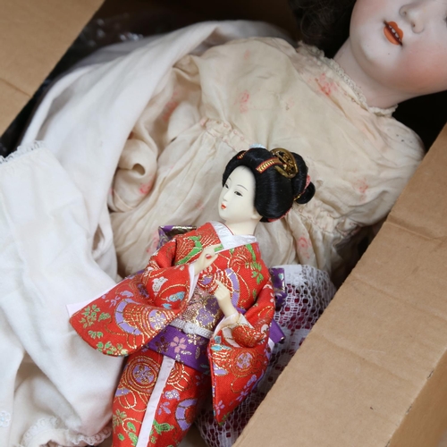 441 - A group of porcelain and composition dolls