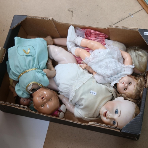 449 - A group of porcelain and composition dolls