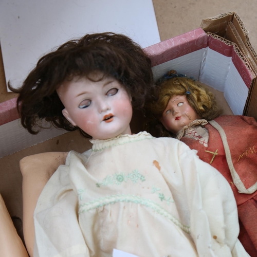 450 - A group of porcelain and composition dolls