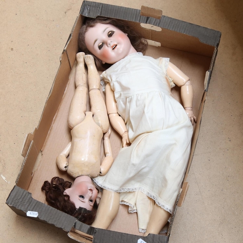 452 - A group of porcelain and composition dolls