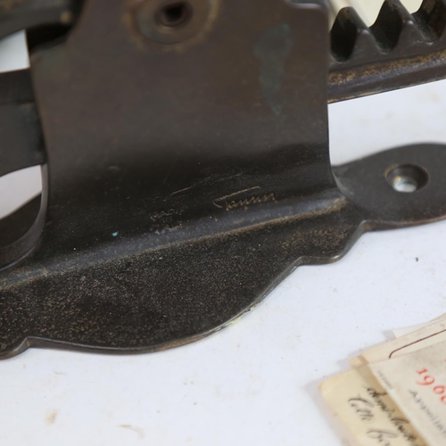 480 - A wall-mounted mechanical brass corkscrew, a bottle of Perrier-Jouet Champagne, various wine labels,... 