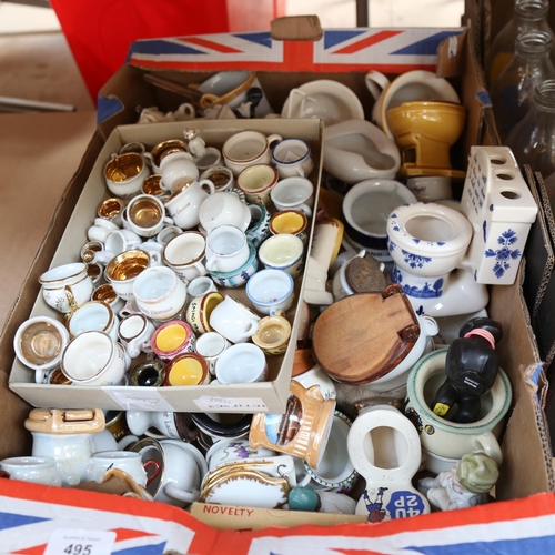 495 - A large collection of ornamental souvenir porcelain lavatories and chamber pots (boxful)