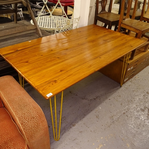 1972 - A rectangular pine plank-top kitchen table, on hairpin legs, L149cm, H75cm, D88cm