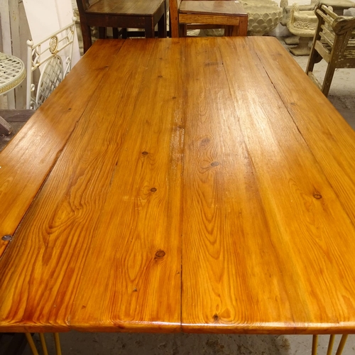 1972 - A rectangular pine plank-top kitchen table, on hairpin legs, L149cm, H75cm, D88cm