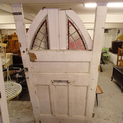 1976 - A pair of Victorian painted arch-top doors, with leadlight coloured glazed panels, and relief carved... 