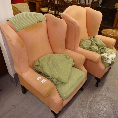 1981 - A pair of upholstered wing armchairs (for re-upholstery)