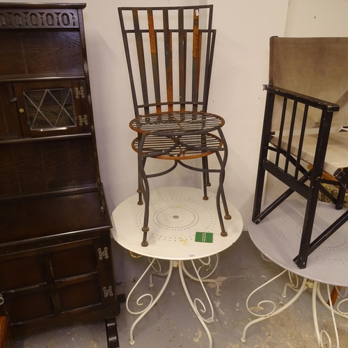 1983 - A white metal circular garden table, and a pair of garden chairs