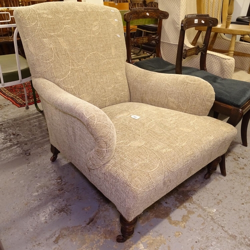 1987 - A Howard style upholstered armchair, on turned mahogany legs