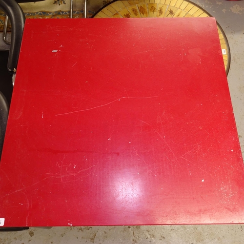 1990 - A red painted metal square-top garden table, W80cm, H75cm