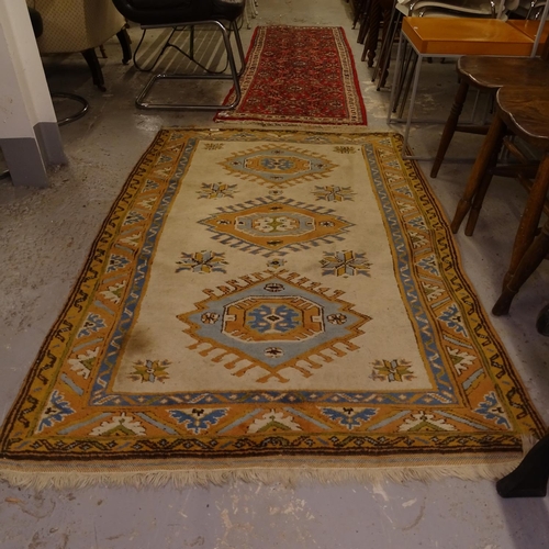 1996 - A cream ground Afghan design rug, 163cm x 108cm