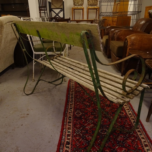 1997 - A wrought-iron scrolled and hardwood slatted garden bench, L118cm