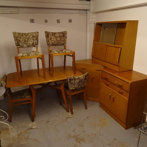 1999 - A mid-century G Plan dining room suite, comprising a drop leaf table on cross stretcher, together wi... 