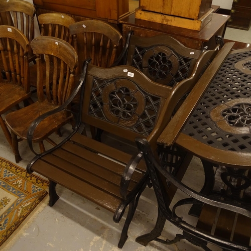 2007 - A painted and wrought-iron garden suite, comprising rectangular low table, garden bench, and a pair ... 