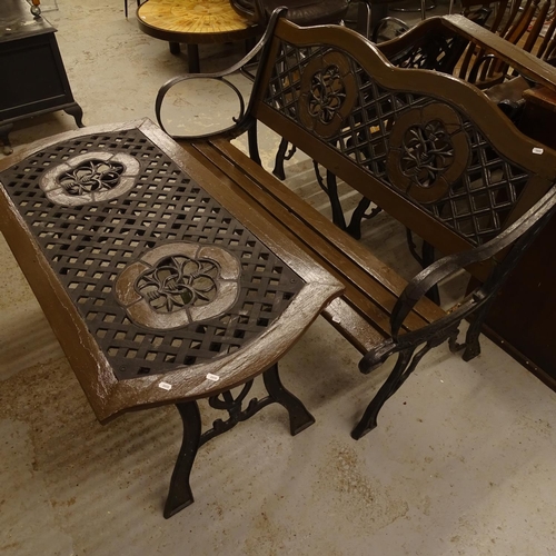 2007 - A painted and wrought-iron garden suite, comprising rectangular low table, garden bench, and a pair ... 