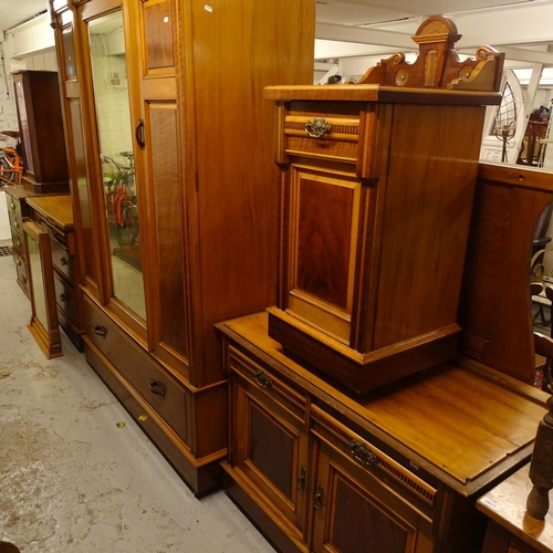 2010 - An Edwardian satin-walnut bedroom suite, comprising mirrored wardrobe, washstand, dressing table, be... 