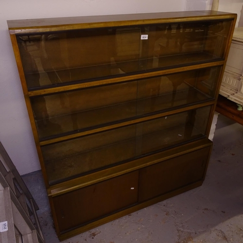 2014 - A mid-century stained beech 4-section bookcase, with sliding glazed doors, W122cm, H135cm, D30cm