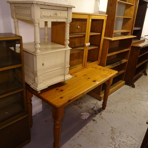 2015 - A rectangular pine kitchen table, W136cm, a pine glazed 2-door bookcase, W95cm, and a French painted... 