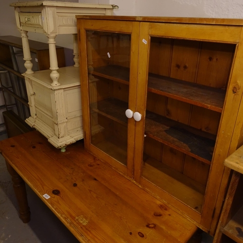 2015 - A rectangular pine kitchen table, W136cm, a pine glazed 2-door bookcase, W95cm, and a French painted... 