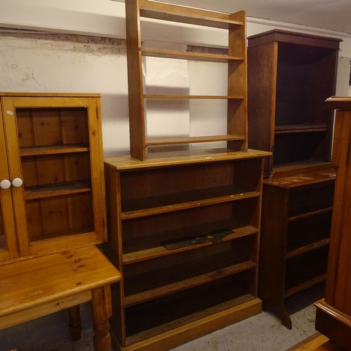 2016 - A 1920s 4-tier open bookcase, W110cm, H122cm, D38cm, and a small 4-tier open bookcase, W77cm