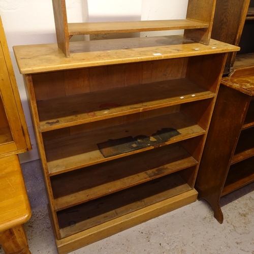 2016 - A 1920s 4-tier open bookcase, W110cm, H122cm, D38cm, and a small 4-tier open bookcase, W77cm