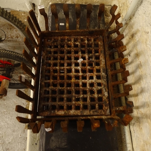 2024 - A cast-iron duck's nest fire grate, and a metal hearth