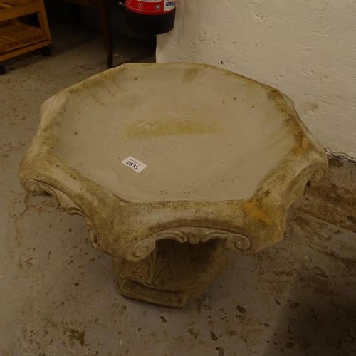 2035 - A concrete 2-section birdbath, on acanthus leaf pedestal, W50cm, H40cm