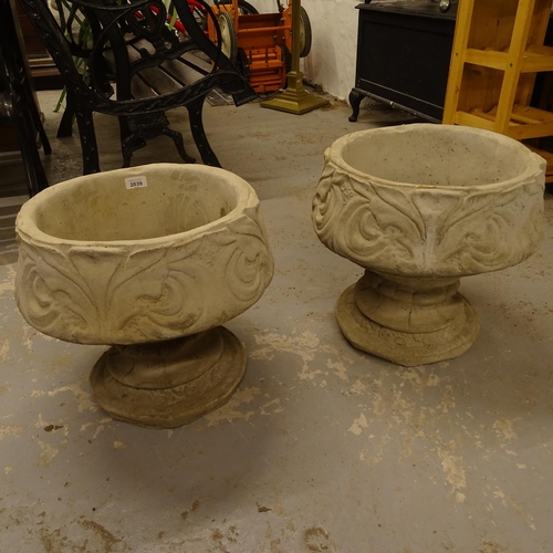 2039 - A pair of concrete 2-section garden pots on pedestal stands, with embossed acanthus leaf decoration,... 