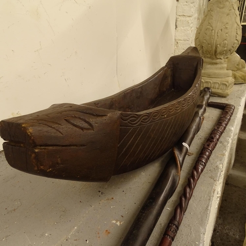 2043 - A hardwood carved trough, and 2 carved hardwood walking sticks