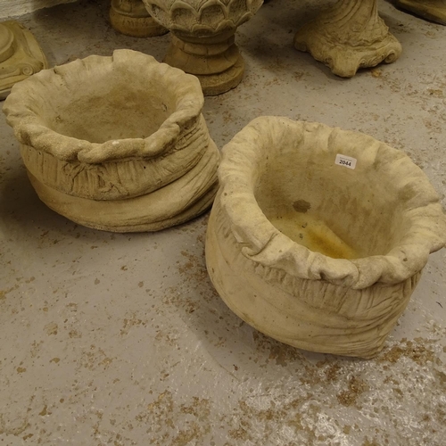 2044 - A pair of sack design concrete planters, W38cm, H26cm