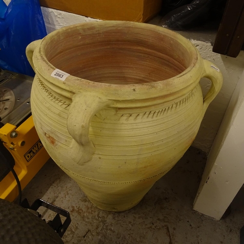 2063 - A terracotta 4-handled olive oil jar, W55cm, H61cm