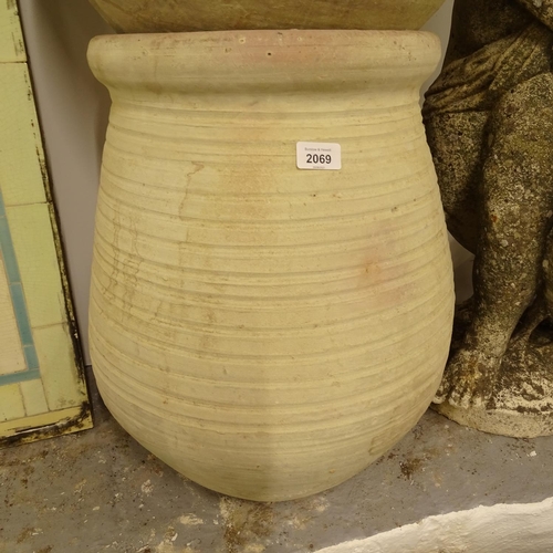 2069 - A pair of ribbed terracotta garden plant pots, W40cm, H53cm