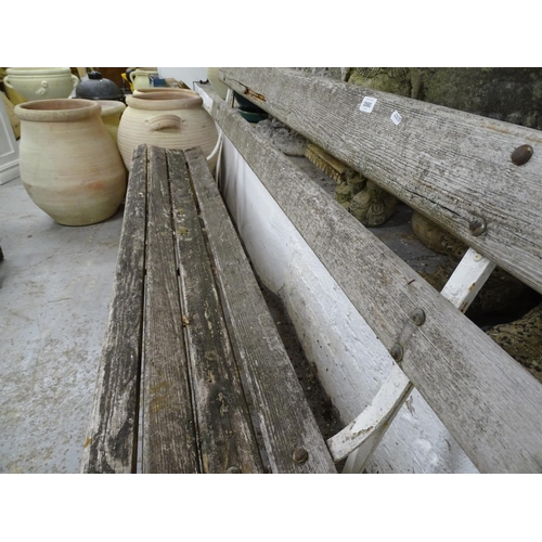 2080 - A hardwood slatted garden bench, on scrolled wrought-iron ends, L183cm