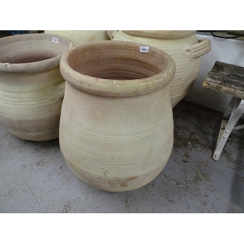 2081 - A terracotta garden pot, W40cm, H58cm