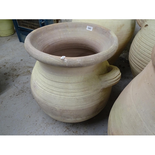 2082 - A terracotta 2-handled garden pot, of waisted form, W55cm, H50cm