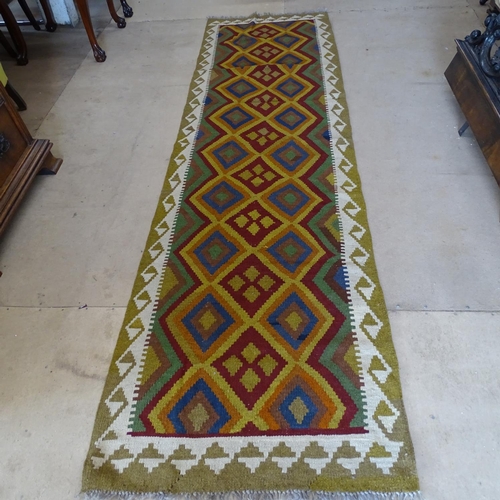 2090 - A Mamainer red ground runner, 298cm x 82cm