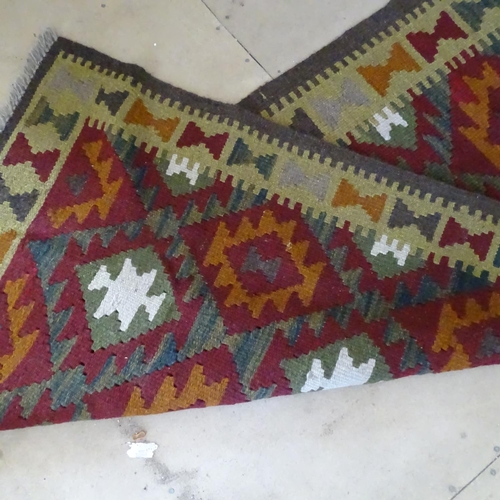 2091 - A Mamainer red ground runner, 298cm x 82cm