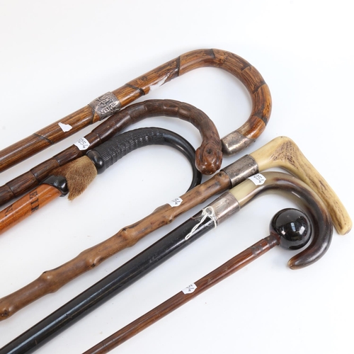 532 - A group of Vintage walking sticks and canes, including silver collars