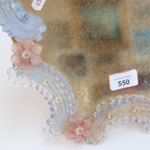 550 - An Italian moulded glass framed dressing table mirror, height 35cm, missing 1 floral mount