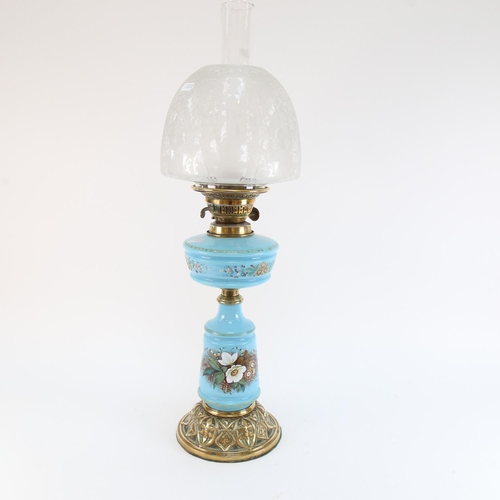 551 - A Victorian blue opaque glass and brass-mounted oil lamp, with etched glass shade, overall height 62... 