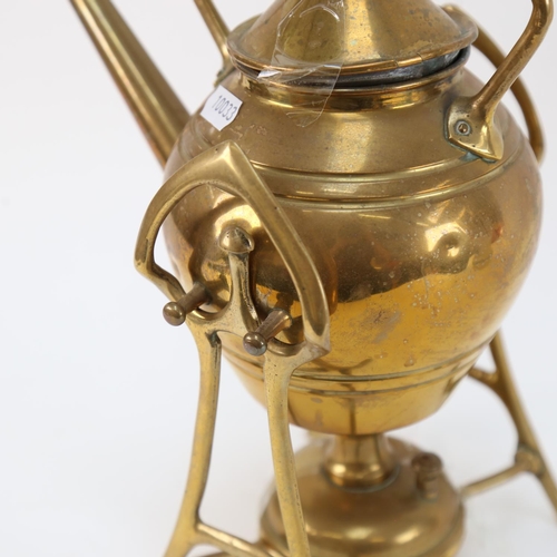 562 - An Arts and Crafts brass spirit kettle on stand, height 31cm