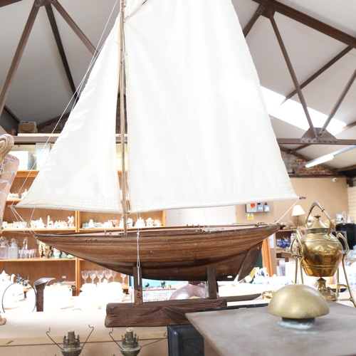 564 - A hand built model sailing ship on stand, height 110cm