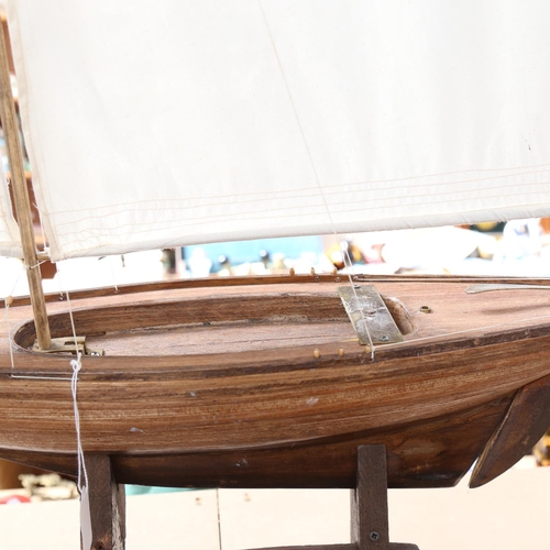 564 - A hand built model sailing ship on stand, height 110cm