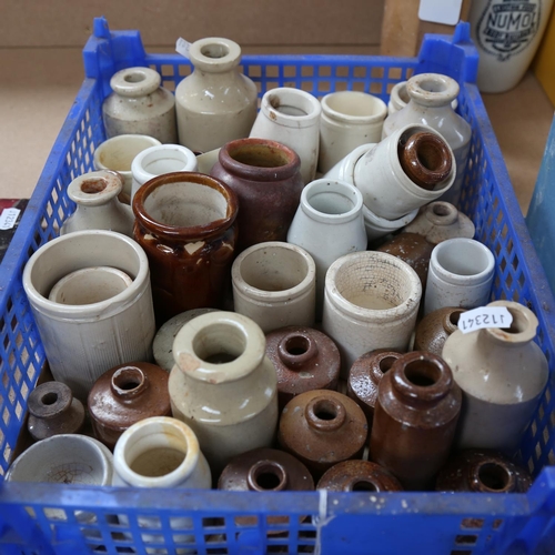 568 - A collection of stoneware ink bottles, and various jars