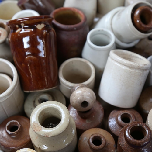 568 - A collection of stoneware ink bottles, and various jars